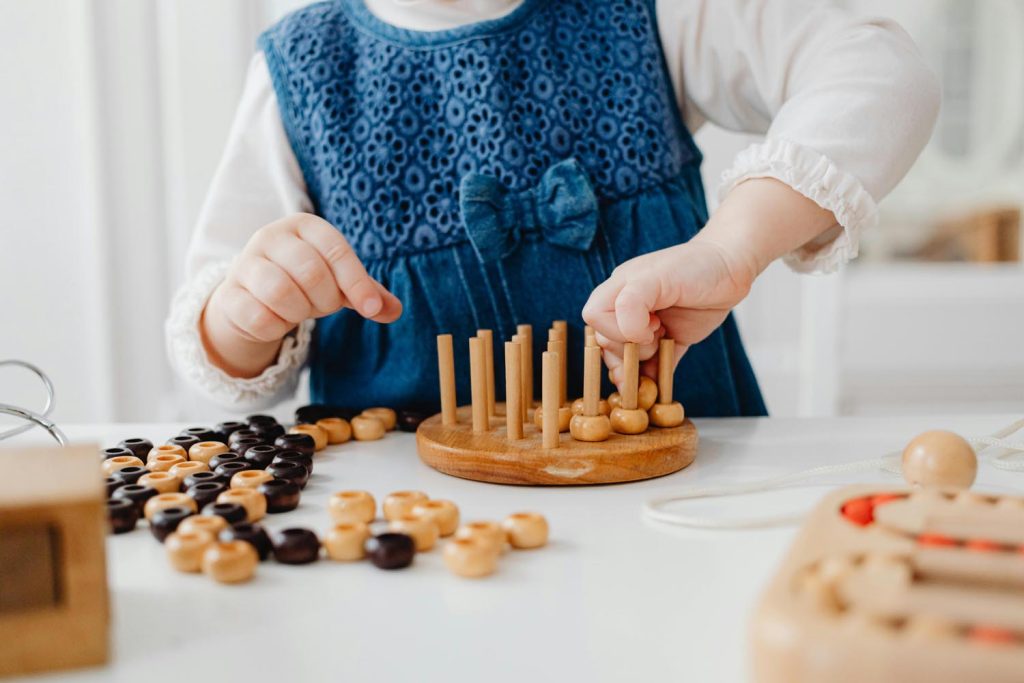 Young girl learning through play during a child focused neuropsychological evaluation.