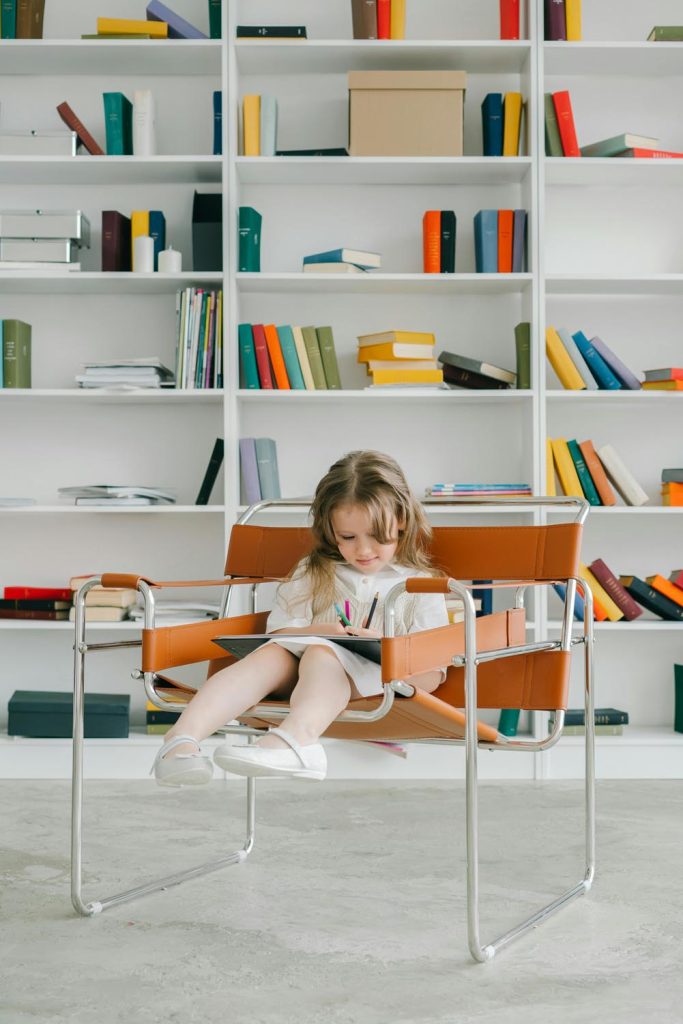 Girl drawing in chair